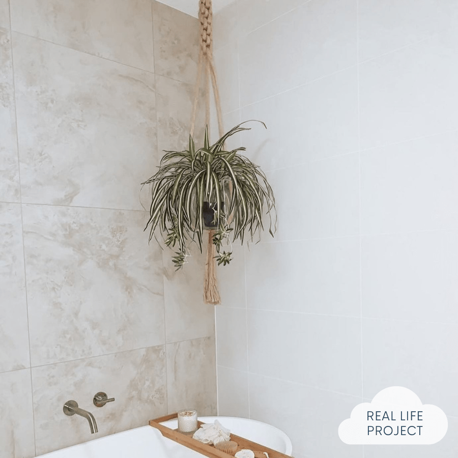 bathroom featuring white and travertine wall tiles