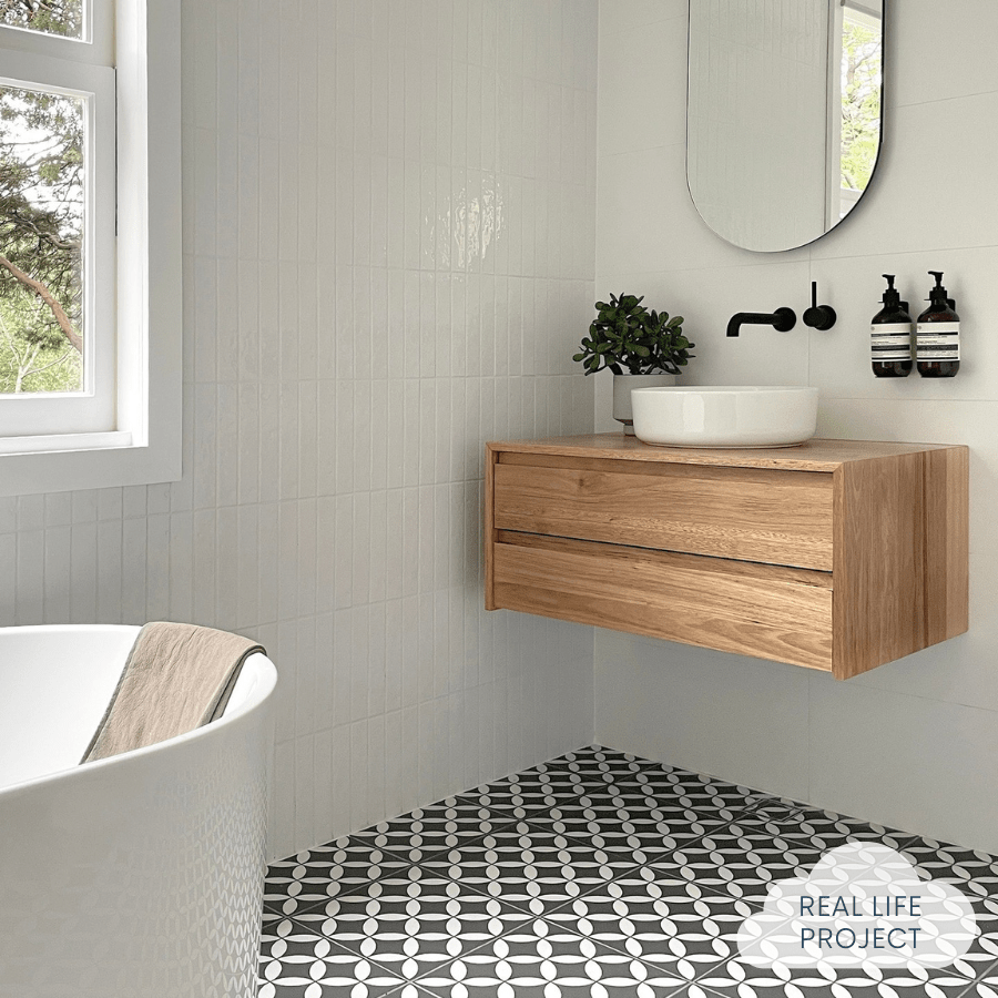 bathroom featuring white wall tiles and encaustic floor tiles